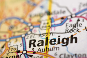 Closeup of Raleigh North Carolina on a road map of the United States.