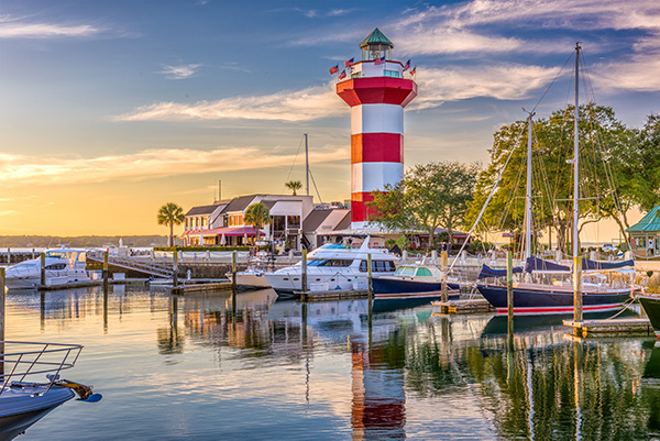 Hilton Head lighthouse at sunset with view of marina