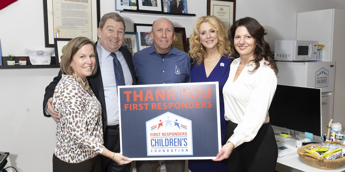Home Clean Heroes and First Responders Children's Foundation holding Thank You First Responders Sign